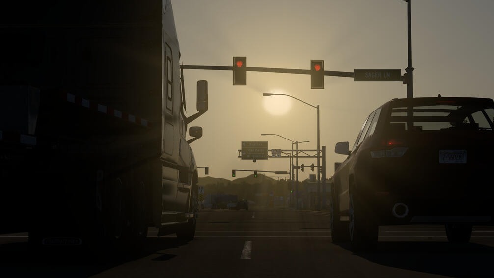 Freightliner Cascadia waiting at a stop light in American Truck Simulator